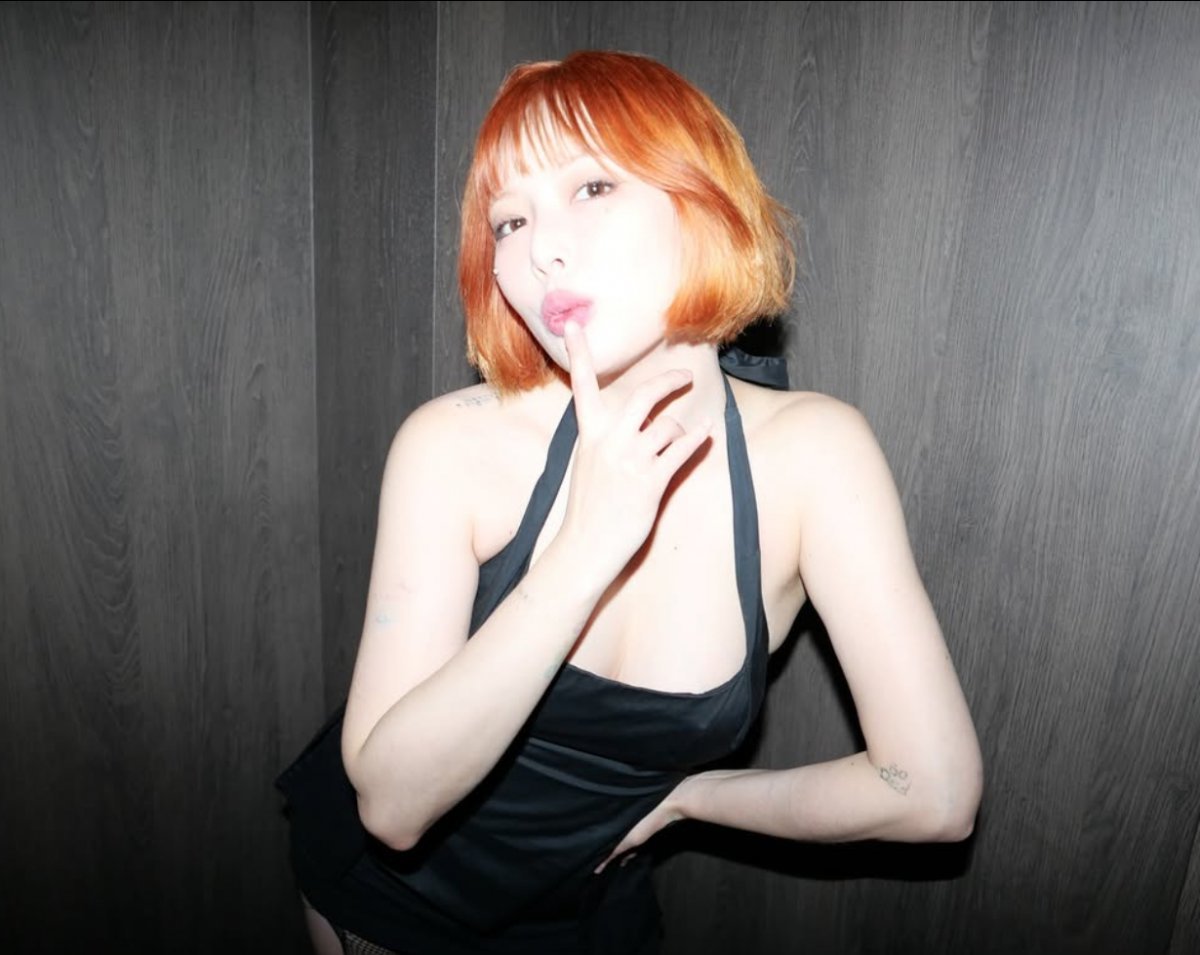 Hyuna showcases a stunning transformation with a fresh orange bob cut on social media