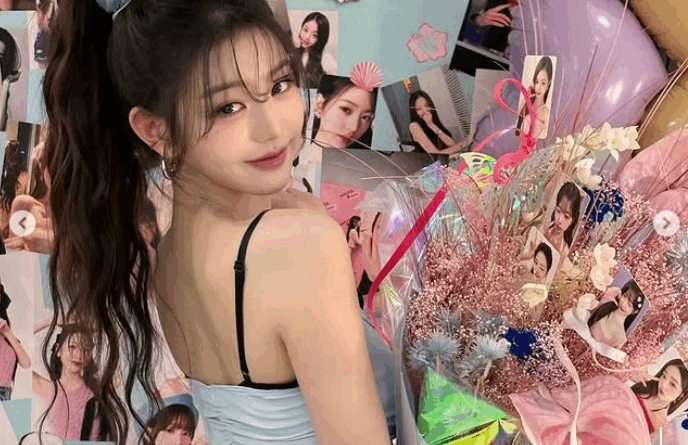 Jang Wonyoung stuns in sky blue outfit with floral bouquet and idol visuals