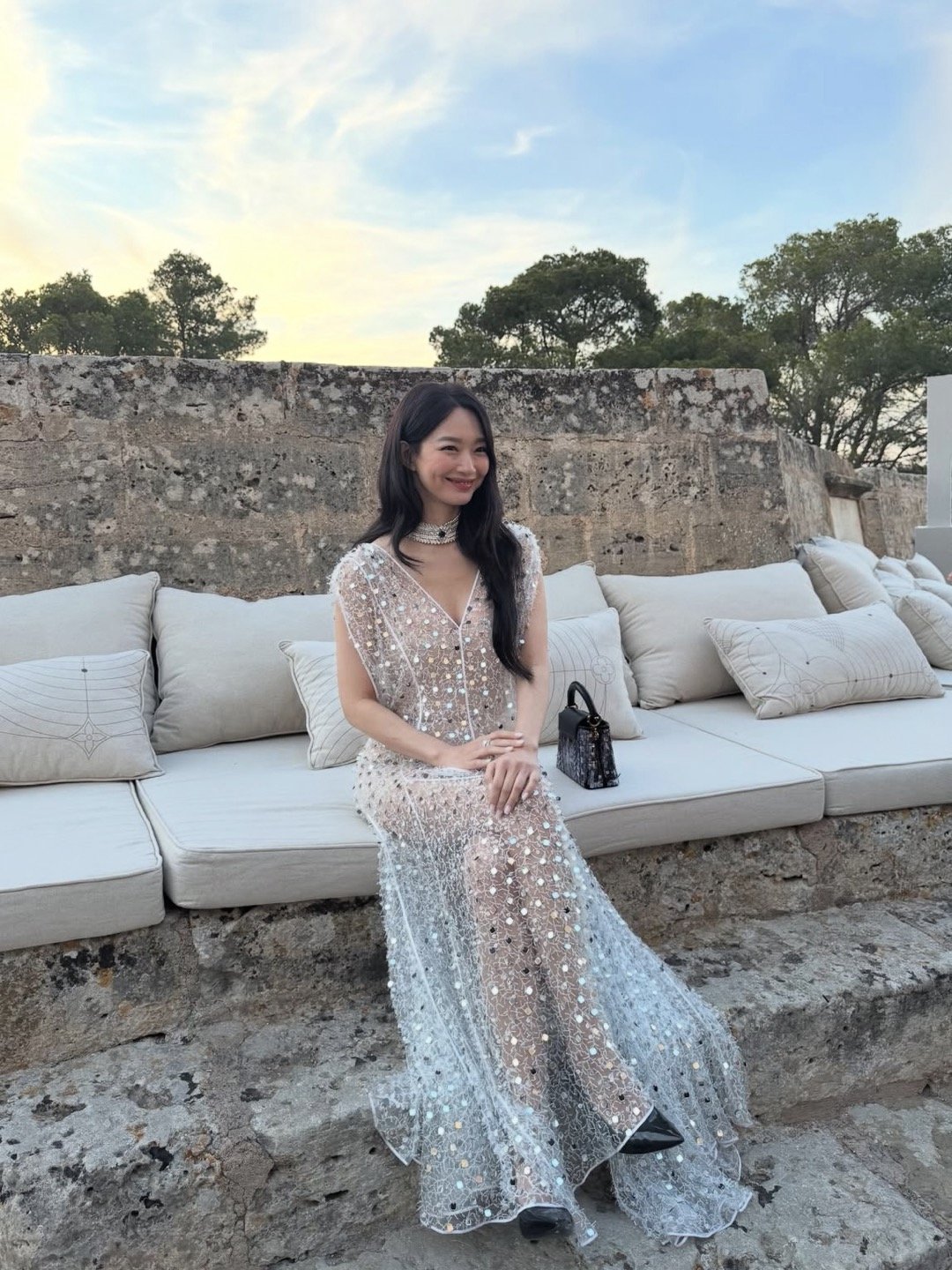 Shin Min-a dazzles in a sequined white dress at a luxury brand event showcasing her elegance