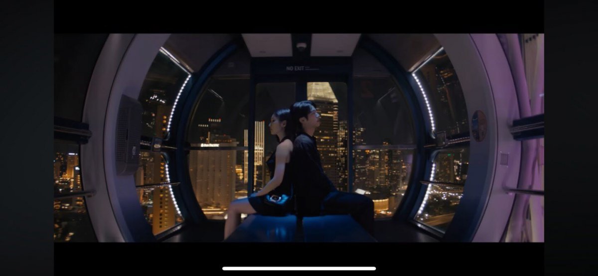 BTS Jin stands amid Singapore's landmarks in a heartfelt music video narrative