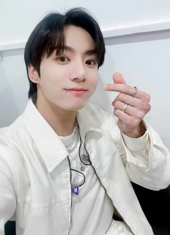 Fans celebrate BTS's Jungkook discharge with colorful bus ads and global support