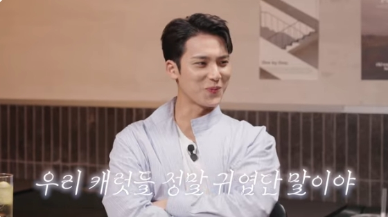 SEVENTEEN's Mingyu shares affection for fans during a milestone anniversary event.